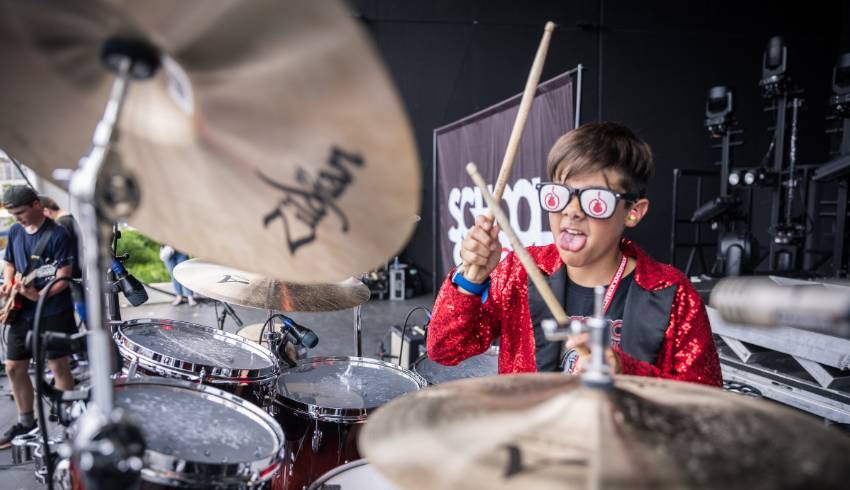 Boy playing drumset