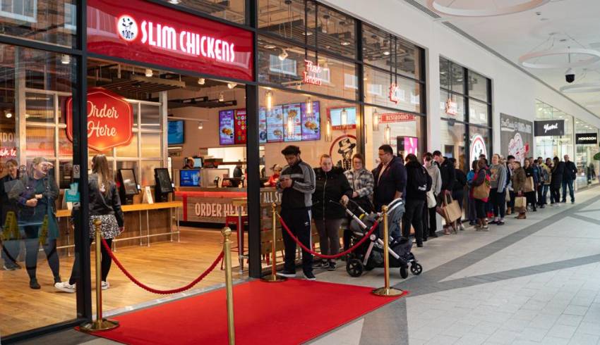 People queuing to get into Slim Chickens